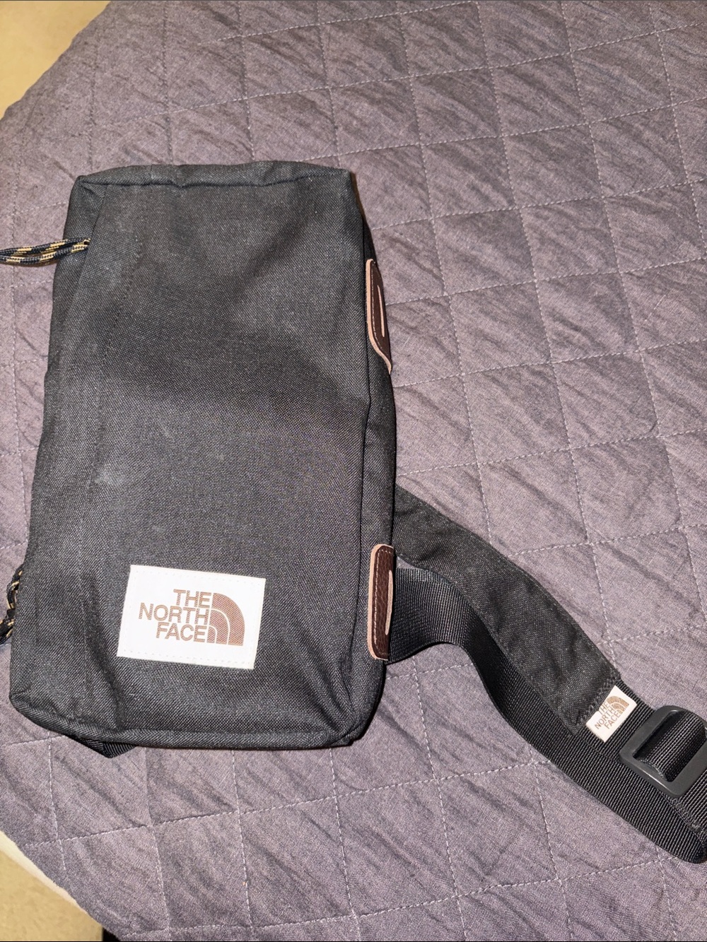 The North Face Black Sling Belt Bag with White Logo